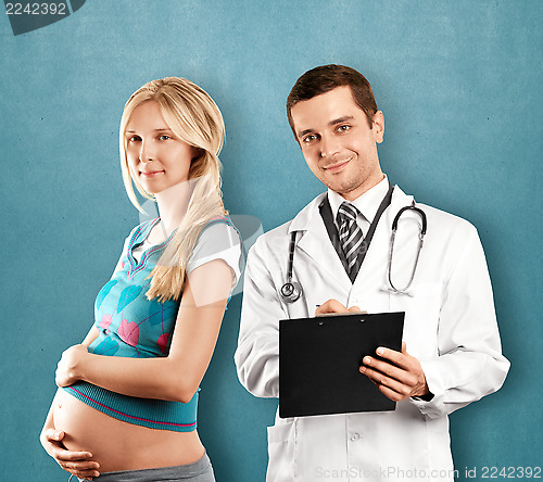 Image of Pregnant Woman With Doctor