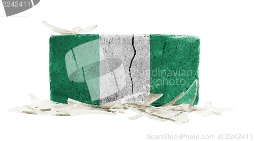 Image of Brick with broken glass, violence concept