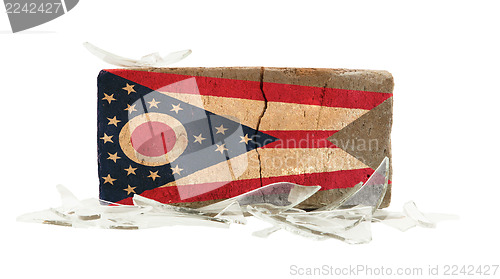 Image of Brick with broken glass, violence concept