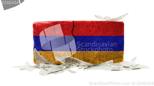 Image of Brick with broken glass, violence concept