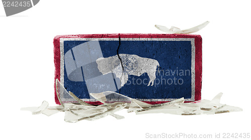 Image of Brick with broken glass, violence concept