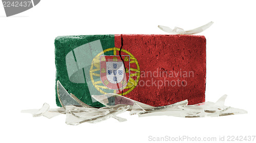 Image of Brick with broken glass, violence concept