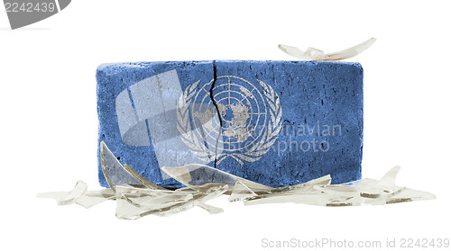 Image of Brick with broken glass, violence concept