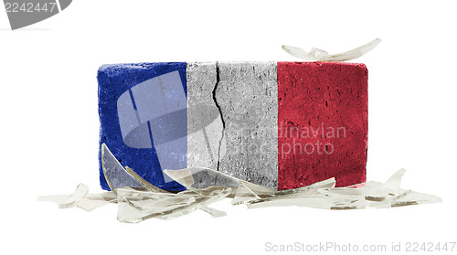 Image of Brick with broken glass, violence concept