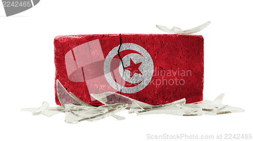 Image of Brick with broken glass, violence concept