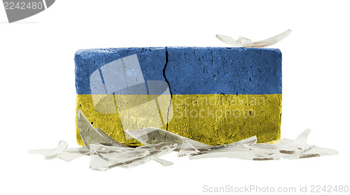 Image of Brick with broken glass, violence concept