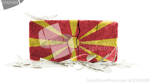 Image of Brick with broken glass, violence concept