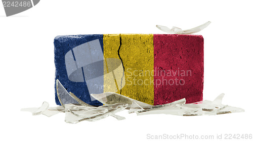 Image of Brick with broken glass, violence concept