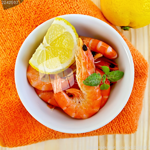 Image of Shrimp in a white bowl on orange napkin