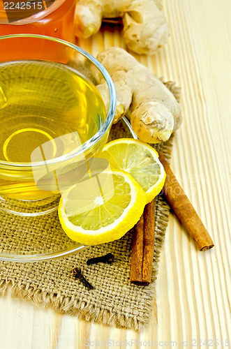 Image of Tea ginger on a burlap with honey and lemon