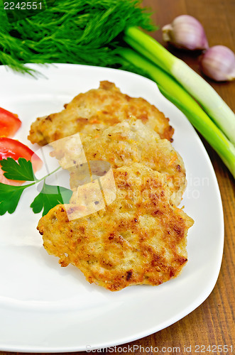 Image of Fritters chicken with vegetables on the board