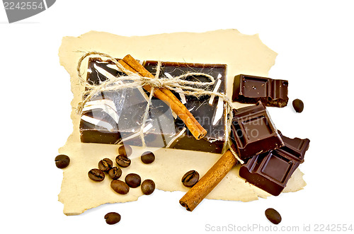 Image of Soap homemade dark with a chocolate on paper