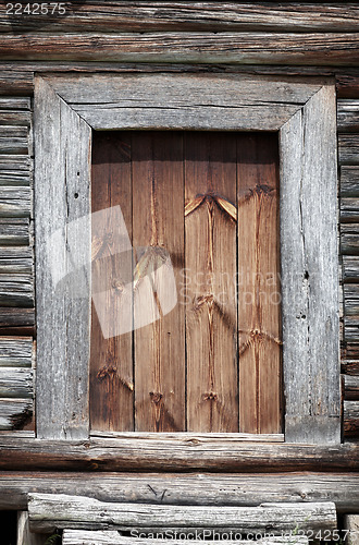 Image of Old wooden rural door close-up