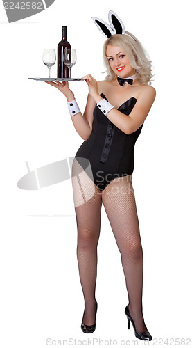 Image of Sexy waitress with a bottle of wine on white