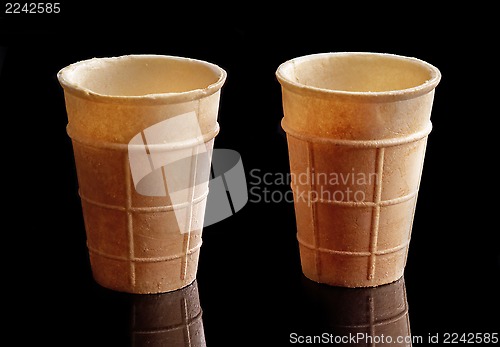 Image of two empty ice cream waffle cones 