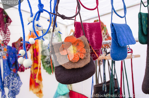 Image of felt wool girl bag sold outdoor street market fair 