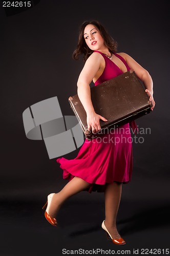 Image of Pretty woman with suitcase
