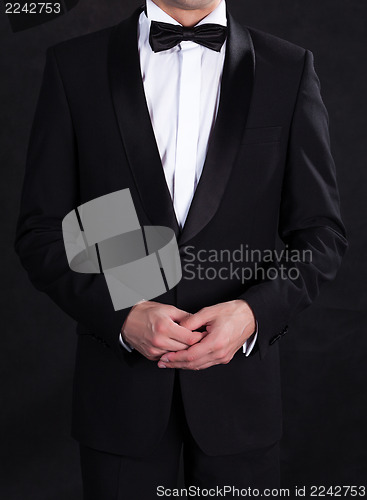 Image of Stylish man in elegant black tuxedo