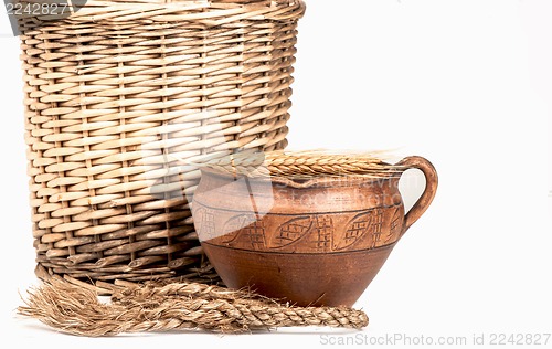 Image of wattled basket, clay jug
