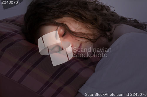 Image of Woman Sleeping in a Red Pillow