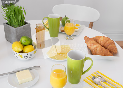 Image of Bright table setting with tasty breakfast