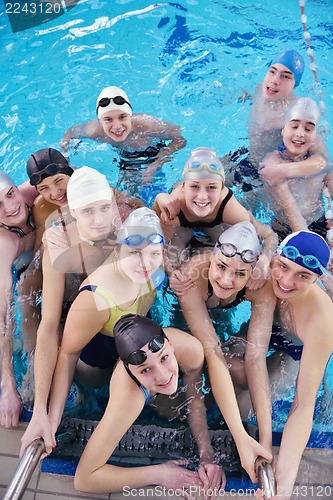 Image of happy teen group  at swimming pool