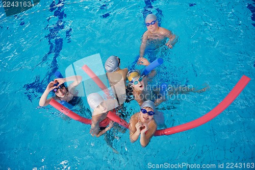 Image of happy children group  at swimming pool