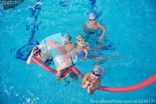 Image of happy children group  at swimming pool