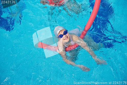 Image of happy children group  at swimming pool