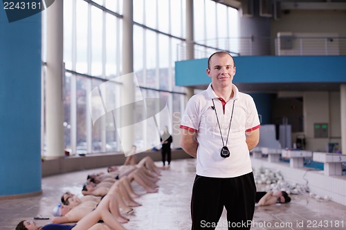 Image of happy children group  at swimming pool