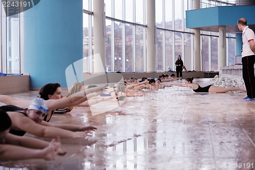 Image of happy children group  at swimming pool