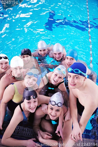 Image of happy teen group  at swimming pool