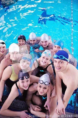 Image of happy teen group  at swimming pool