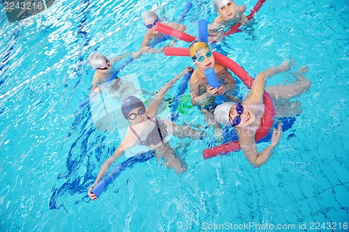 Image of happy children group  at swimming pool