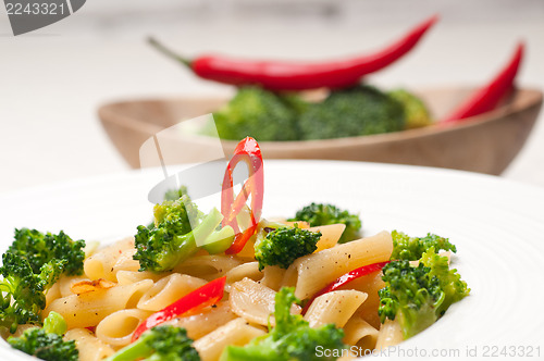 Image of Italian penne pasta with broccoli and chili pepper