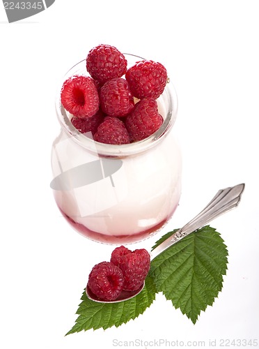Image of Fresh Yogurt in a jar with Raspberries, leaves