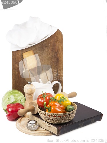 Image of Chef's hat with battledore and cook book