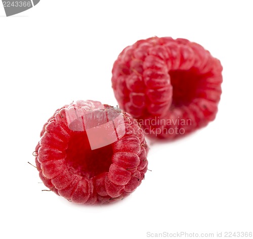 Image of Ripe raspberry with green leaf