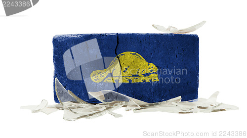 Image of Brick with broken glass, violence concept