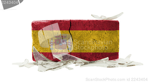 Image of Brick with broken glass, violence concept