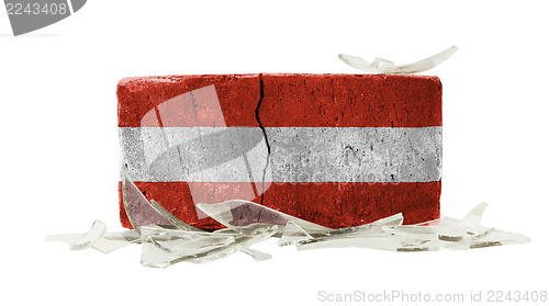 Image of Brick with broken glass, violence concept