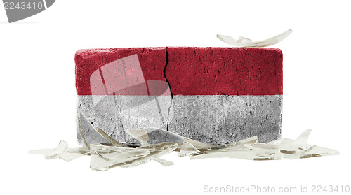 Image of Brick with broken glass, violence concept