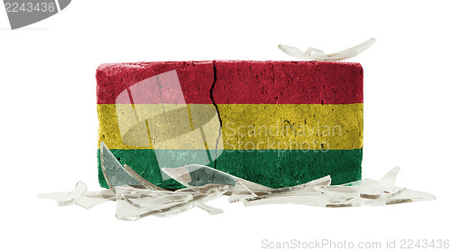 Image of Brick with broken glass, violence concept