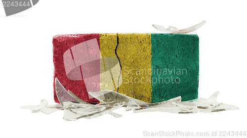 Image of Brick with broken glass, violence concept