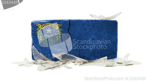 Image of Brick with broken glass, violence concept