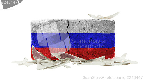 Image of Brick with broken glass, violence concept