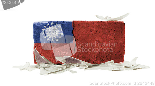 Image of Brick with broken glass, violence concept