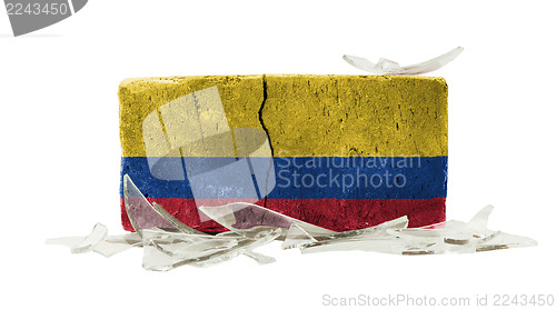 Image of Brick with broken glass, violence concept