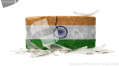 Image of Brick with broken glass, violence concept