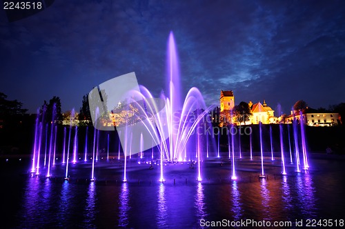 Image of illuminated fountain at night in Warsaw. Poland